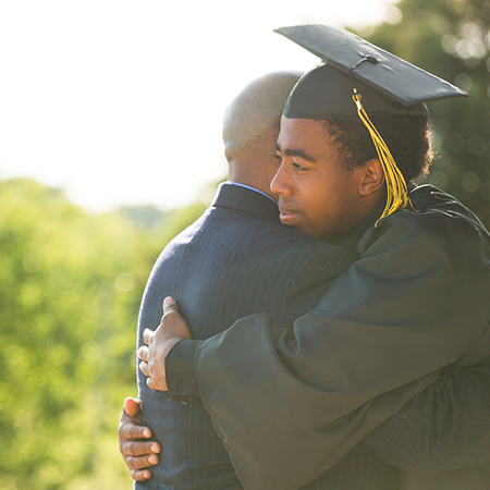A graduate giving a hug 